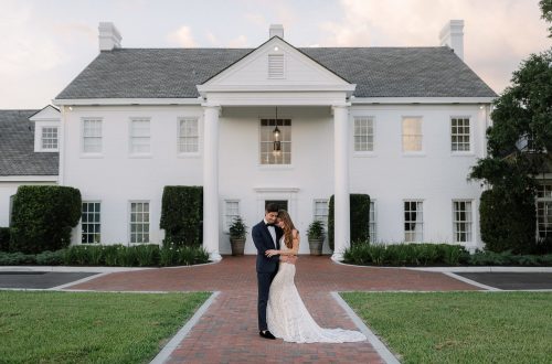Adams-Estate Newlywed husband and wife standing in front of the Adams Estate
